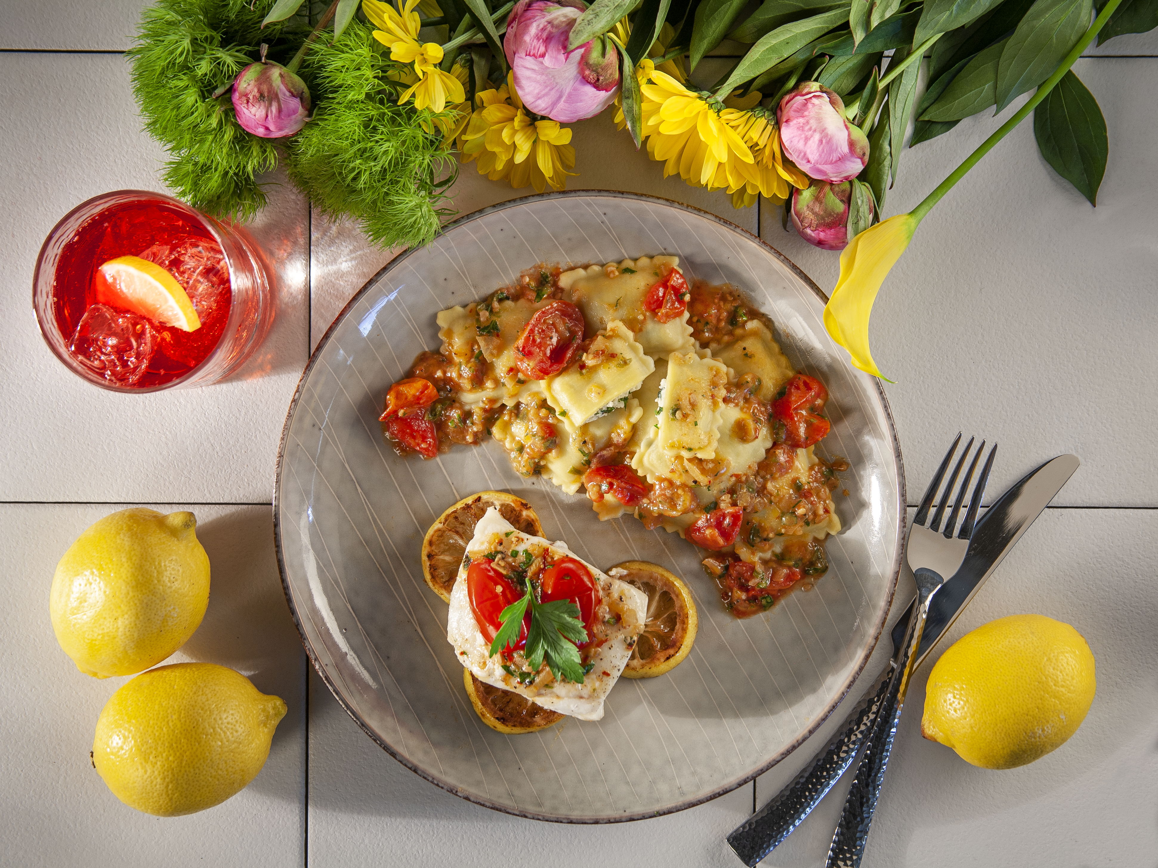 Oven Baked Cod with Spinach and Cheese Ravioli with Tomato, Herb Butter Sauce